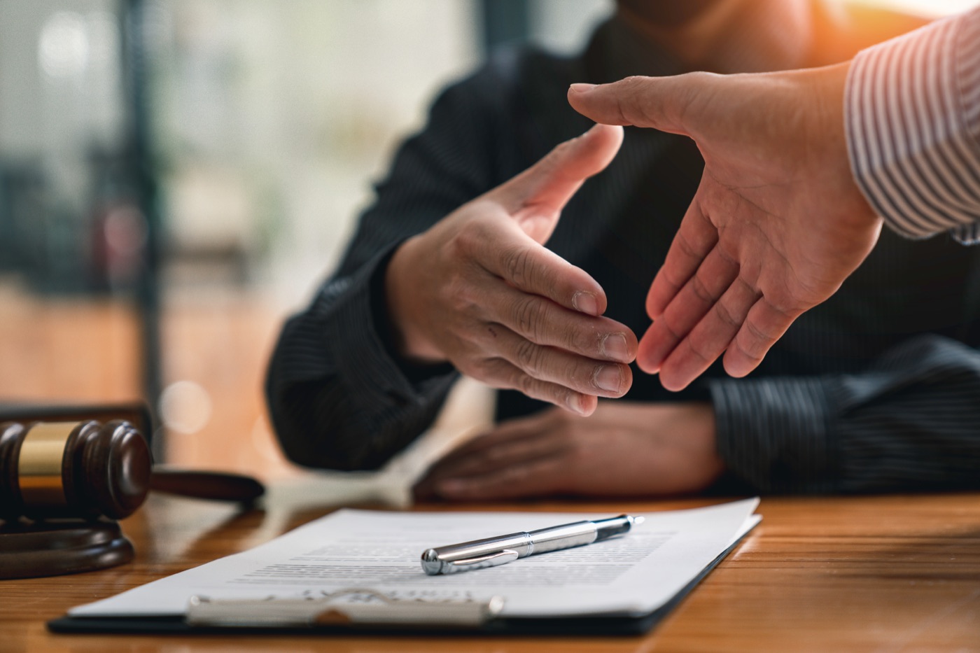 Business parties reaching an agreement over legal documents